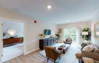 a living room with couches and chairs and a table at Edgebrook Residences, Merrimack, NH