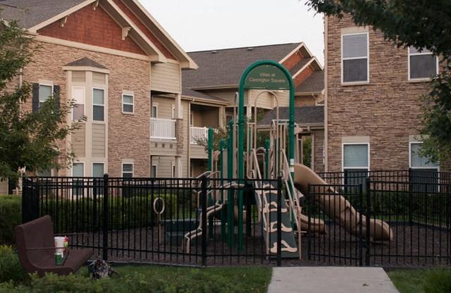 Children have a place to run and play at Villas too! Slides, Climbing Equipment and Bike Parking at Villas at Carrington Square Apartments, Overland Park, KS 66221