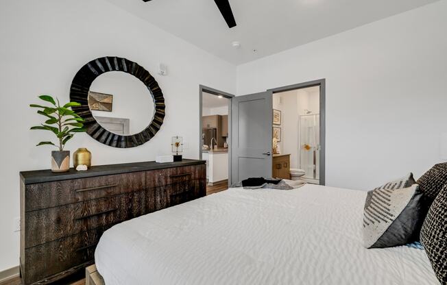 a bedroom with a large bed and a wooden dresser at Prism at Diamond Ridge, Pennsylvania, 15108