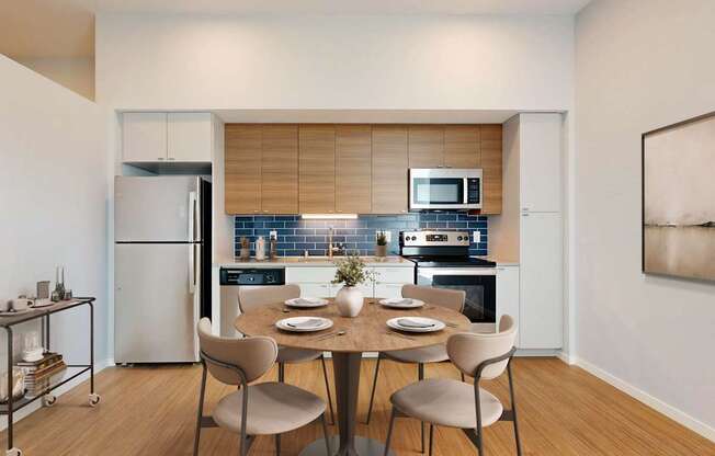A modern kitchen with a dining table set for four.