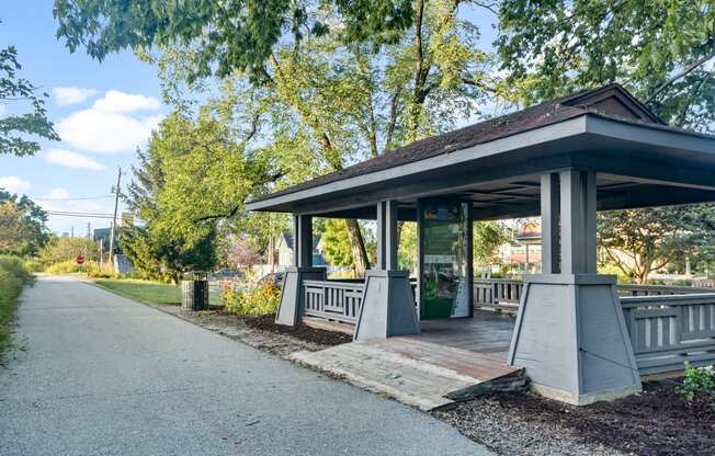 a covered pavilion on the side of a road