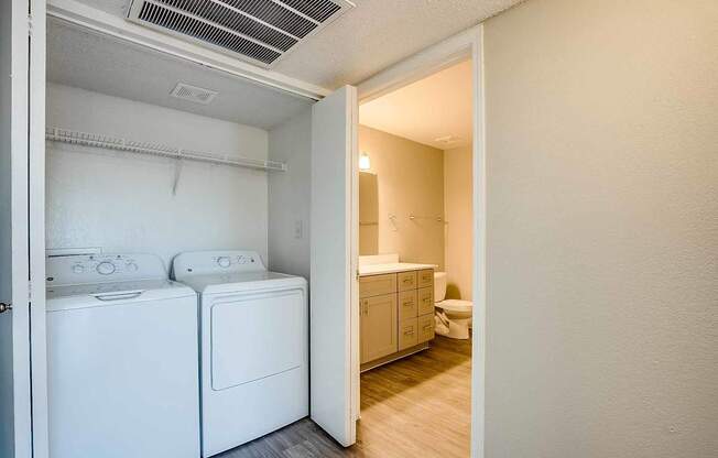 A laundry room with a washer and dryer at Sterling Point Apartment Homes, Phoenix, 85042