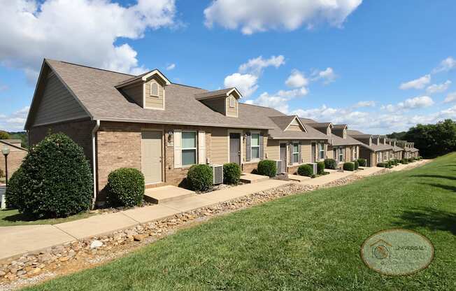 A row of one bedroom townhomes with garages.