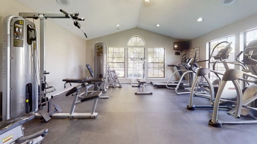 a gym with a lot of exercise equipment