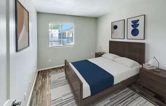 A bedroom with a bed, nightstand, and two framed pictures on the wall.