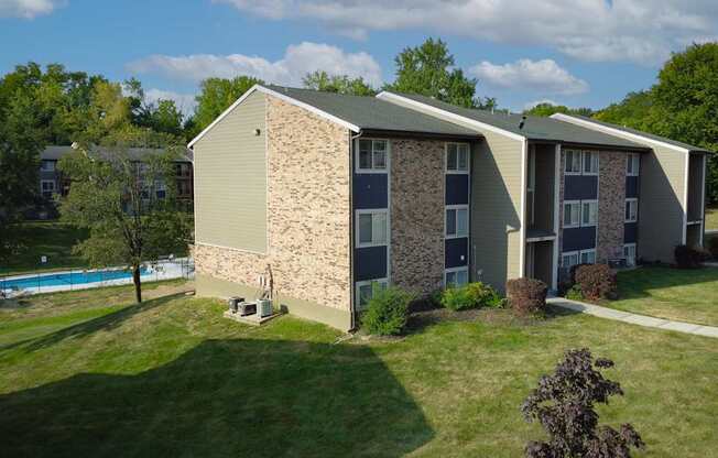 A building with a pool in the backyard.