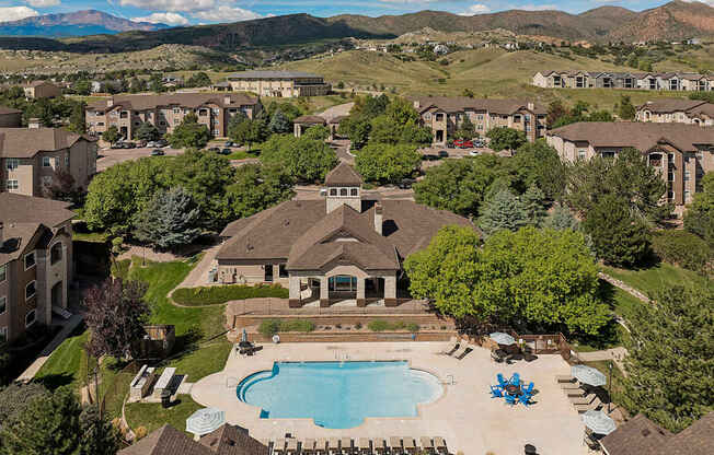 Aerial view of the resort-style swimming pool and property - Grand Centennial Apartments