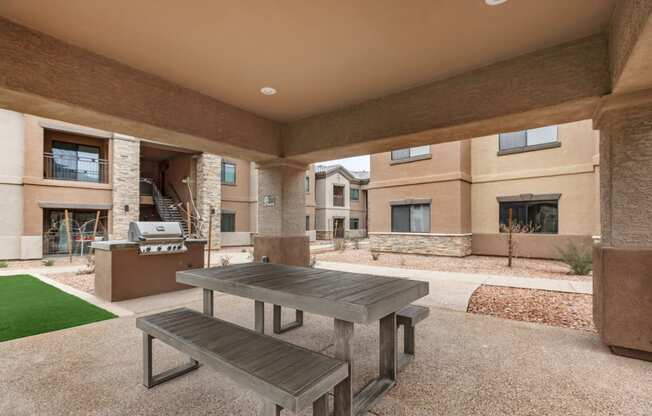 Outdoor covered patio with gas grill and picnic table | Villas at San Dorado