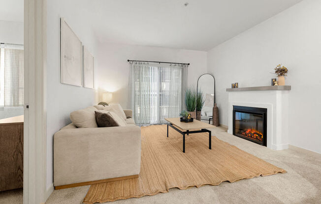 a living room with a couch and a fireplace