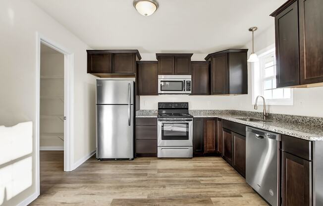 Kitchen with espresso cabinets at Hudson Ridge, Pennsylvania, 17356