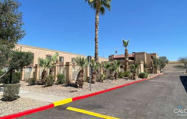 A street with a red and yellow line in the middle of it.