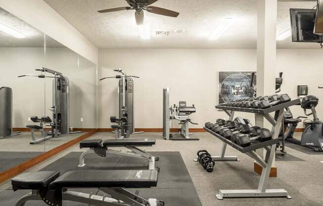 Fitness center with free weights and weightlifting machines at Villas of Omaha townhome apartments in northwest Omaha NE 68116