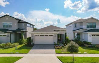 Gorgeous 3/2 Modern Home with a 2 Car Garage in the Highly Desired Enclave at Lakes of Harmony - St Cloud!