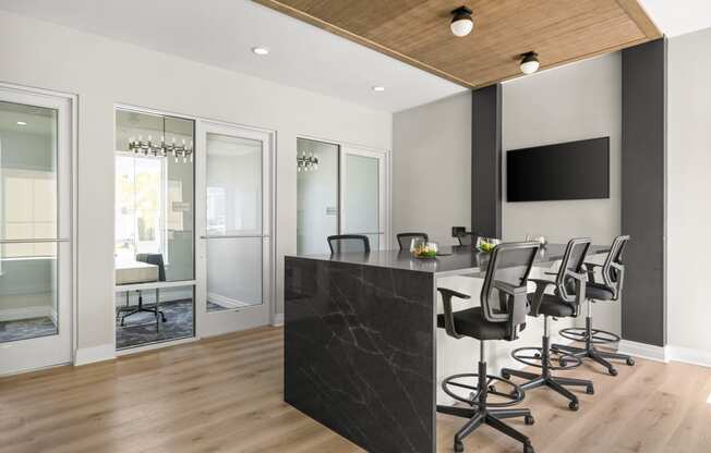 a conference room with a black counter and chairs at Palm Grove in Ellenton, FL 34222