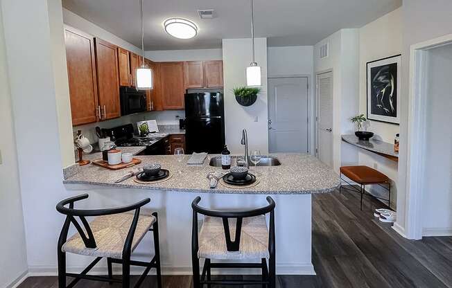 Kitchen with breakfast bar at Two Addison Place Apartments , Georgia, 31322