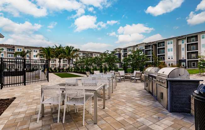 chairs, tables, and grills at Vantage apartments in cape coral, fl