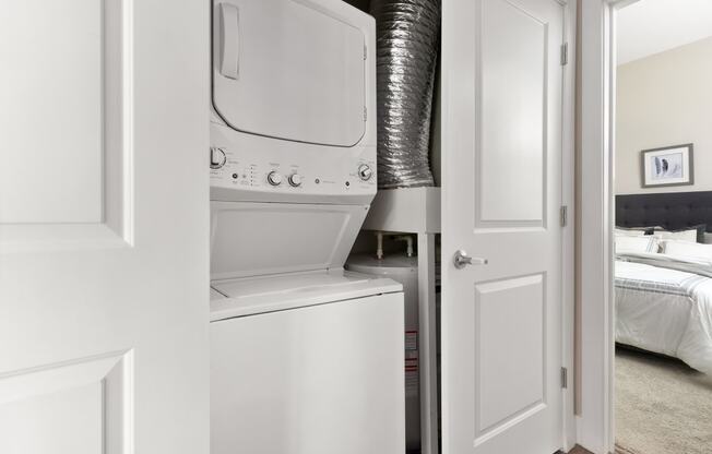 a white washer and dryer in a white laundry room at Hayden Lofts, Dublin, OH