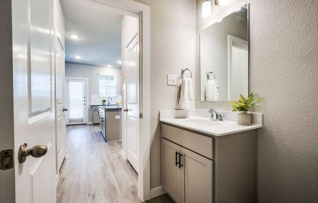 Canvas at Denton Guest bathroom downstairs hardwood style flooring single family homes for rent in denton texas, build to rent, homes for rent in Denton, professionally managed rental home community, private yards, low maintenance, pet-friendly.
