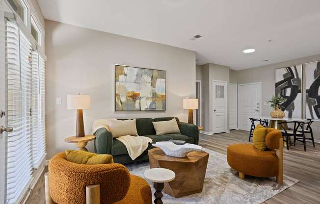 Flatiron West Trade Apartments interior model unit with chairs, small table and pineapple shaped desk pot