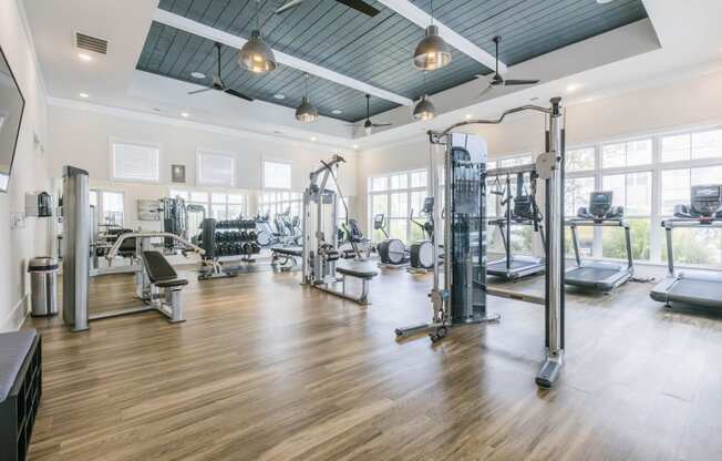 the gym is equipped with weights and cardio equipment at the preserve at great neck apartments
