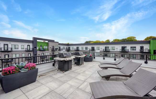 rooftop patio at the yards and backyards apartmens with sun chairs and planters