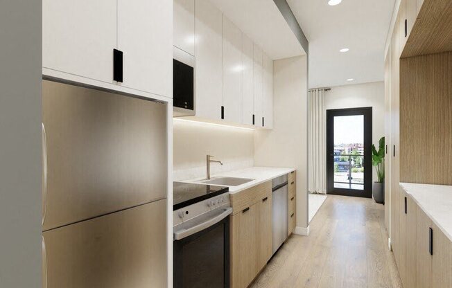 A modern kitchen with stainless steel appliances and wooden cabinets.
