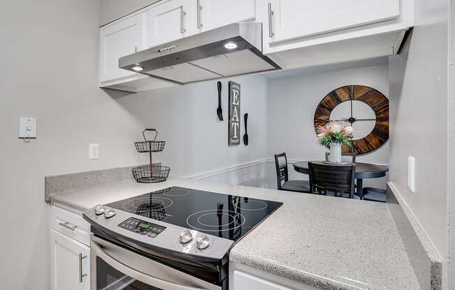 Stainless Steel Stove Overlooking the Dining Room Area