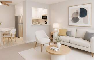 A modern living room with a white sofa, a wooden coffee table, and a painting on the wall.