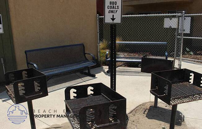 a street sign and benches on a sidewalk