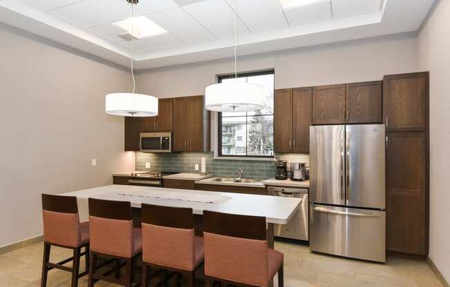 Montreal Courts Apartments in Little Canada, MN | Community Room Kitchen