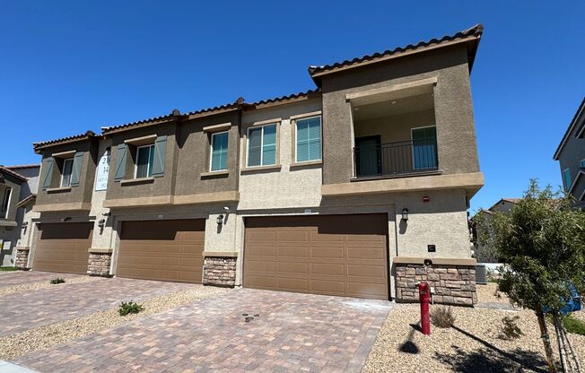 Modern townhome with attached 2 car garage in gated community.