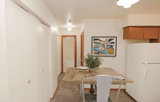 apartment dining room with a table and chairs