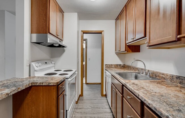 Welcome to Central Lakes of Uptown, where modern living meets comfort. This stylish kitchen boasts elegant cabinetry, sleek appliances, and ample space for culinary creativity. Elevate your lifestyle today—schedule a tour and see for yourself!
