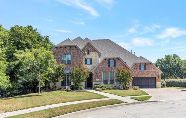 Grand Flower Mound home on heavily treed lot