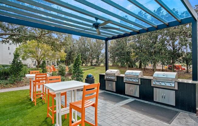 a patio with a table and chairs under a blue roof