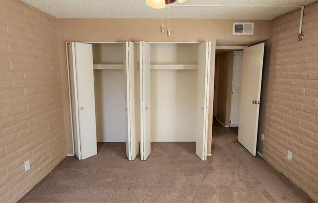 2x2 Upstairs Brown Upgrade Guest Bedroom with Closets at Mission Palms Apartment Homes in Tucson AZ