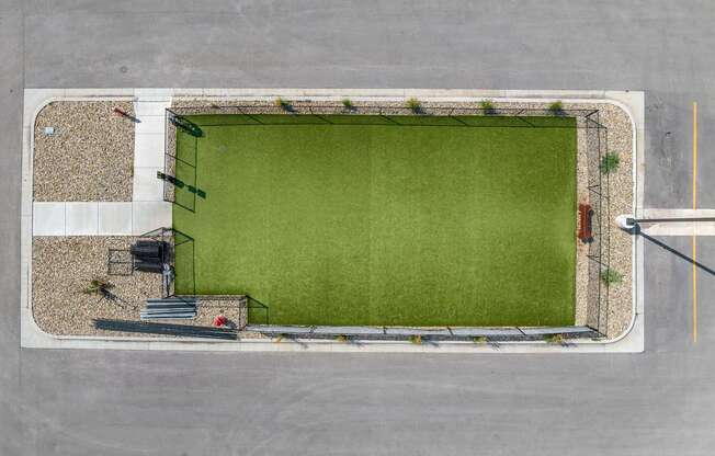 an aerial view of a football field in a parking lot at Red Rock Apartments, Rapid City