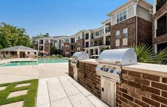 Village at Marquee Station apartments outdoor grilling area