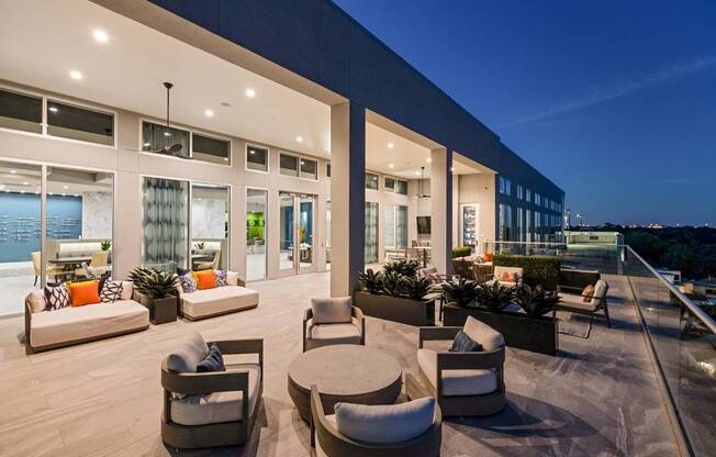 a spacious living room with furniture and a patio