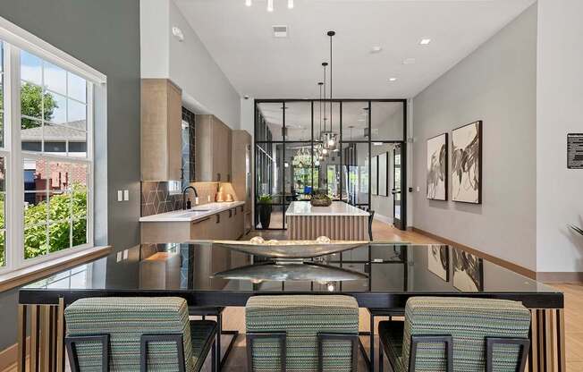 A modern kitchen with a glass table and chairs.