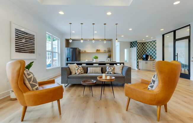 a living room with white walls and hardwood flooring