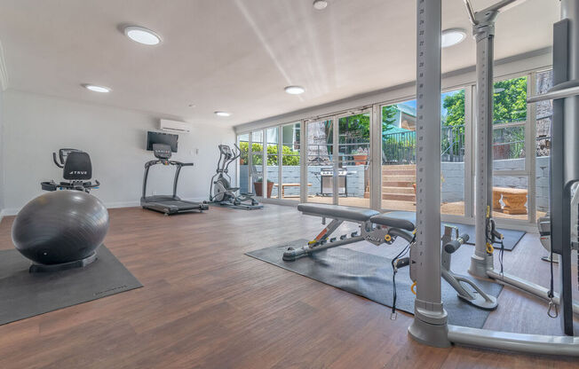 the gym is equipped with a yoga ball and other fitness equipment at The Flats on Addison, Sherman Oaks, CA 91423