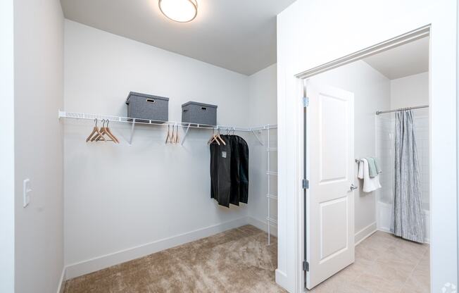 a closet in a bedroom with a door to a shower at Fairmont at South Lake, Bowie, MD