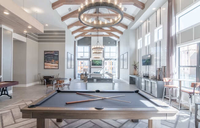 a pool table in the clubhouse at the preserve at great falls