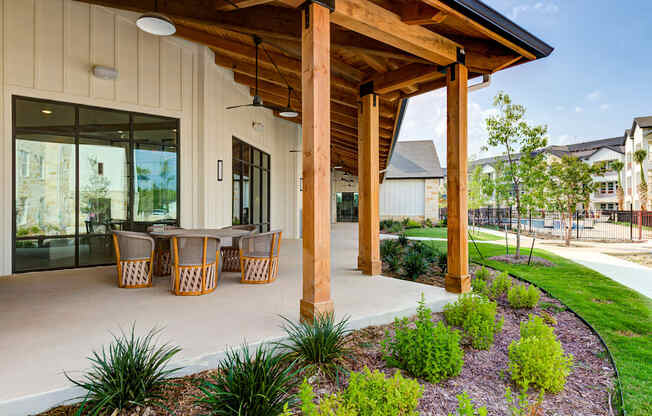 a covered patio with a table and chairs at Legacy at Cibolo, Boerne