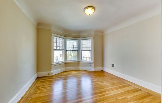 TOP FLOOR! LARGE CLOSET! On-Site LAUNDRY!  DISHWASHER! HARDWOOD!