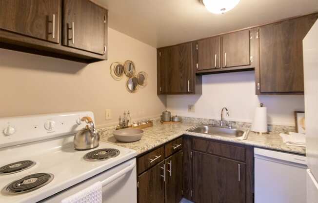 This is a picture of the kitchen in the 980 square foot, 2 bedroom, 1 bath model apartment at Fairfield Pointe Apartments in Fairfield, Ohio.