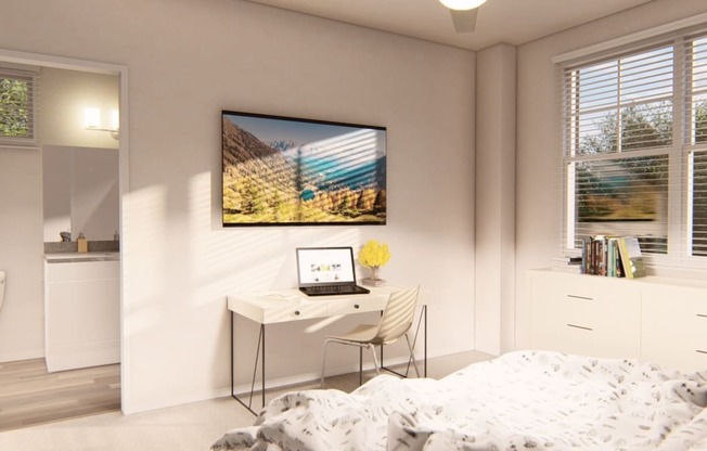 a bedroom with a bed and a desk with a laptop at Brownstones at Palisade Park Townhomes, Broomfield, 80023