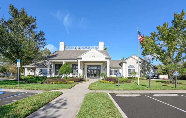 a white house with an flag in front of it