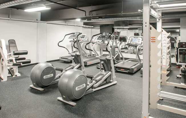 Cardio equipment and weight training machines inside The Pepper Building's fitness center, a premier apartment complex near Fitler Square, Philadelphia.
